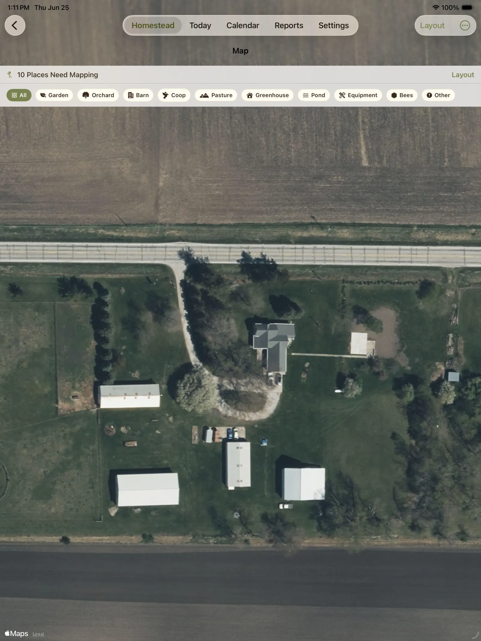 Satellite map showing barns, fields, driveway, and property structures.